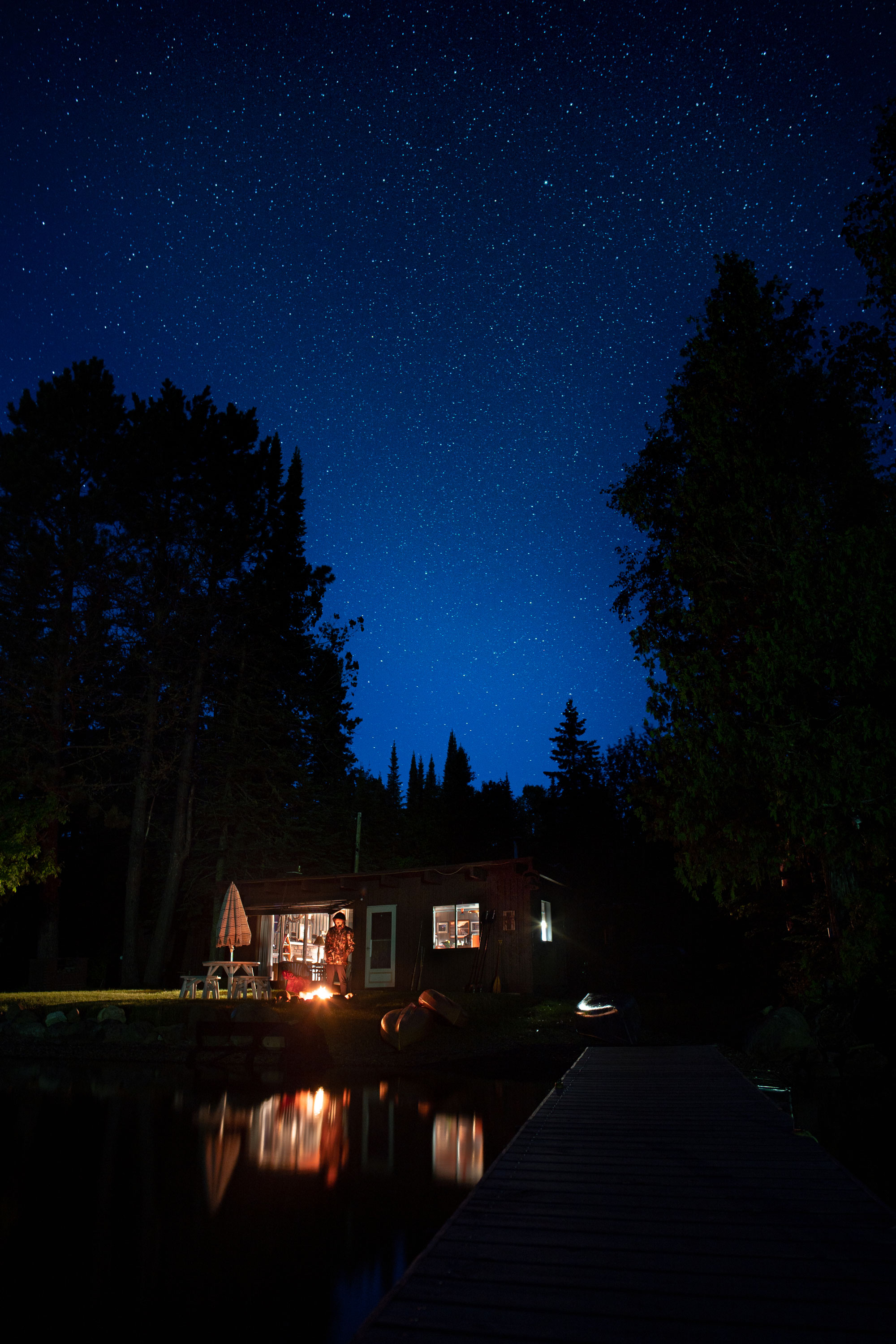 Cabin by the lake at night