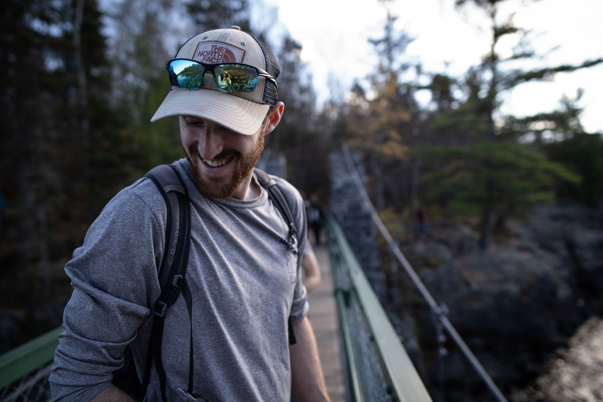 Man smiling on bridge