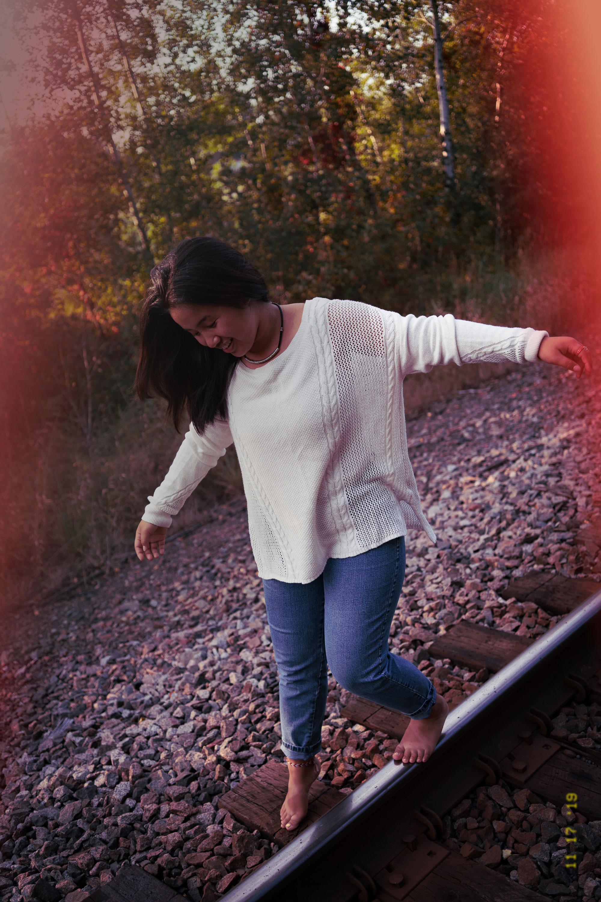 Woman on train tracks